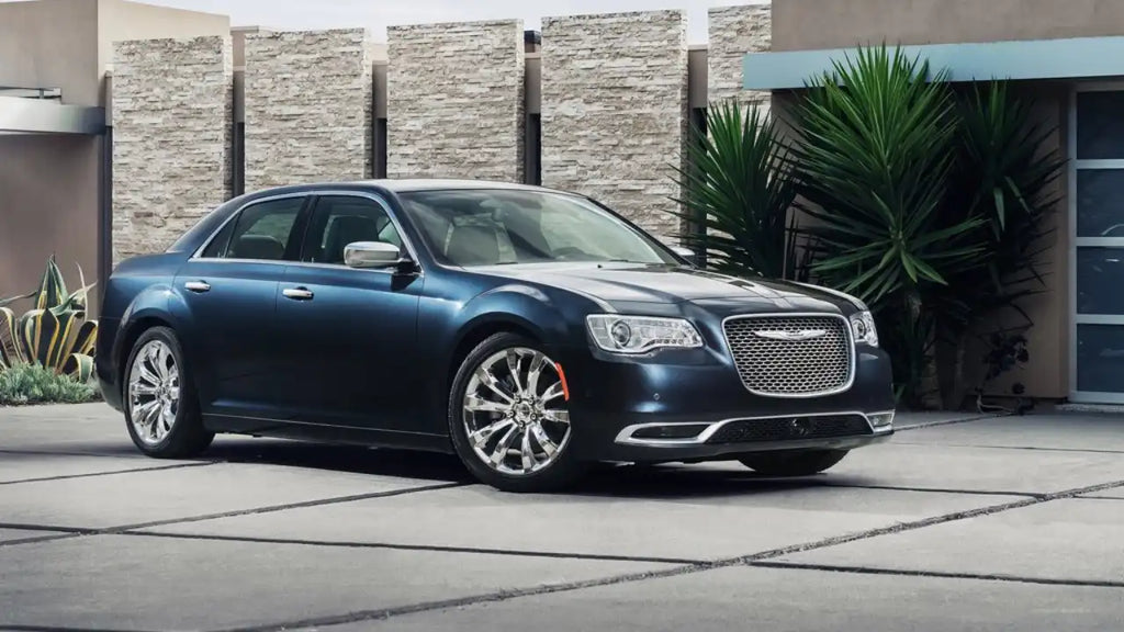 2015 Chrysler 300, a stylish sedan displayed against a scenic backdrop, highlighting its eleganse and performance.